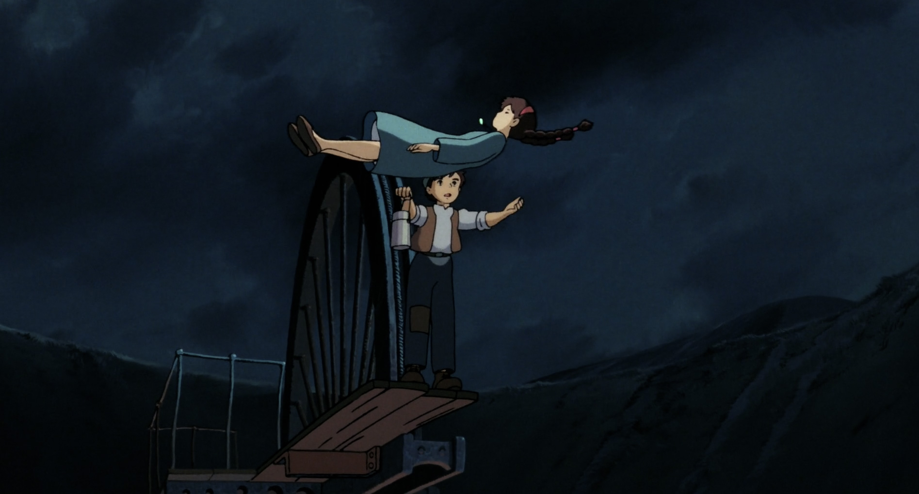 Pazu catches Sheeta as she floats down from the sky in the 1986 movie Castle in the Sky, written and directed by Hayao Miyazaki